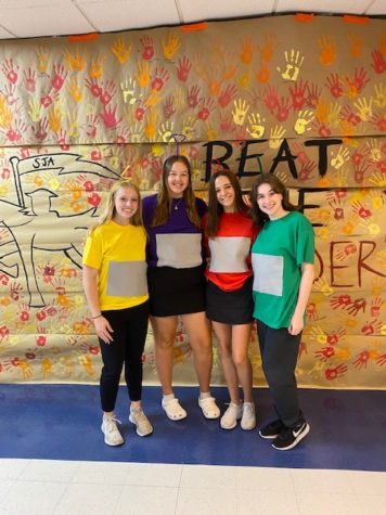 Seniors Taylor Reboulet, Marie Thomas, Emma Keenan, and Lauren Cunningham dressed up as the Teletubbies for movie character day!