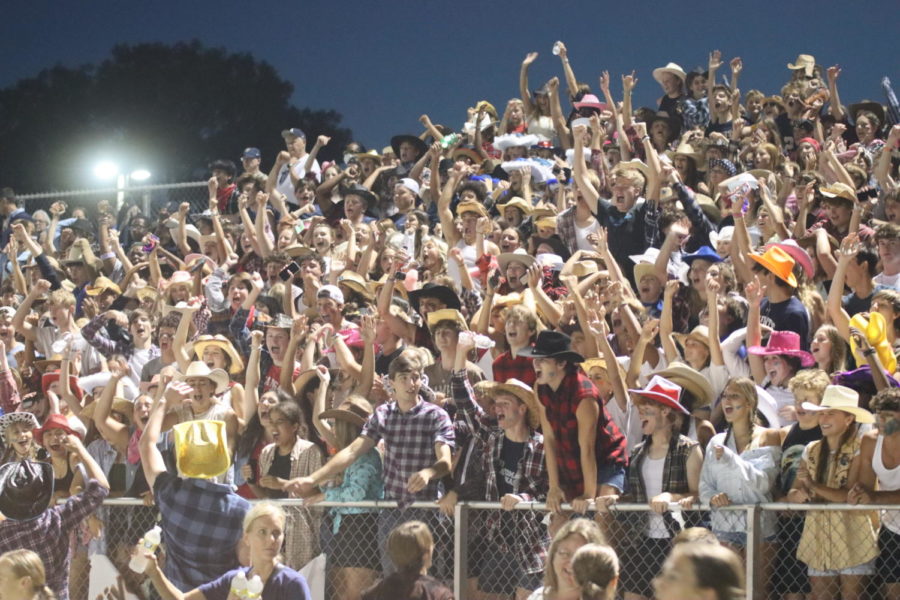 Aquinas+students+cheering+on+the+football+team+in+their+best+western+gear.
