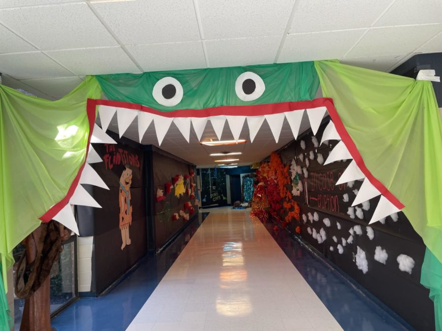 A gaping dinosaur mouth greets students in hello hallway. 