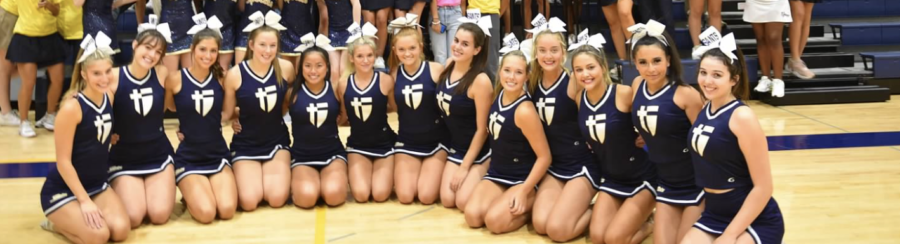 Saint Cheerleaders huddled in front of their class during the 2022 Fall Sport Assembly!