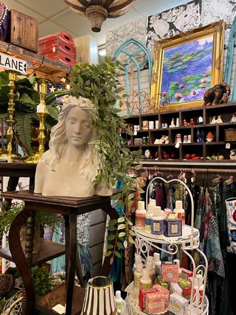 This is a booth from the store Sentimental Journey that is selling clothes, soap, statues, and art. Image by Macy Vance.